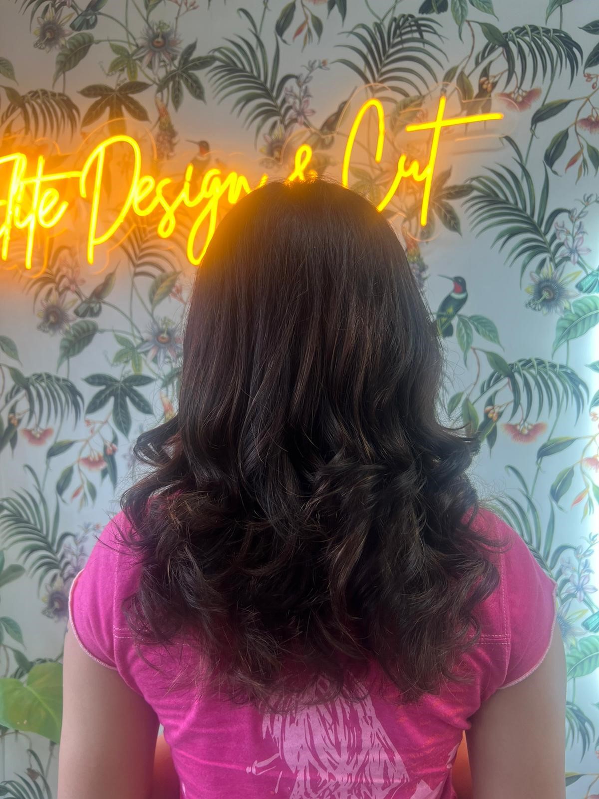 Cut and curls dark hair