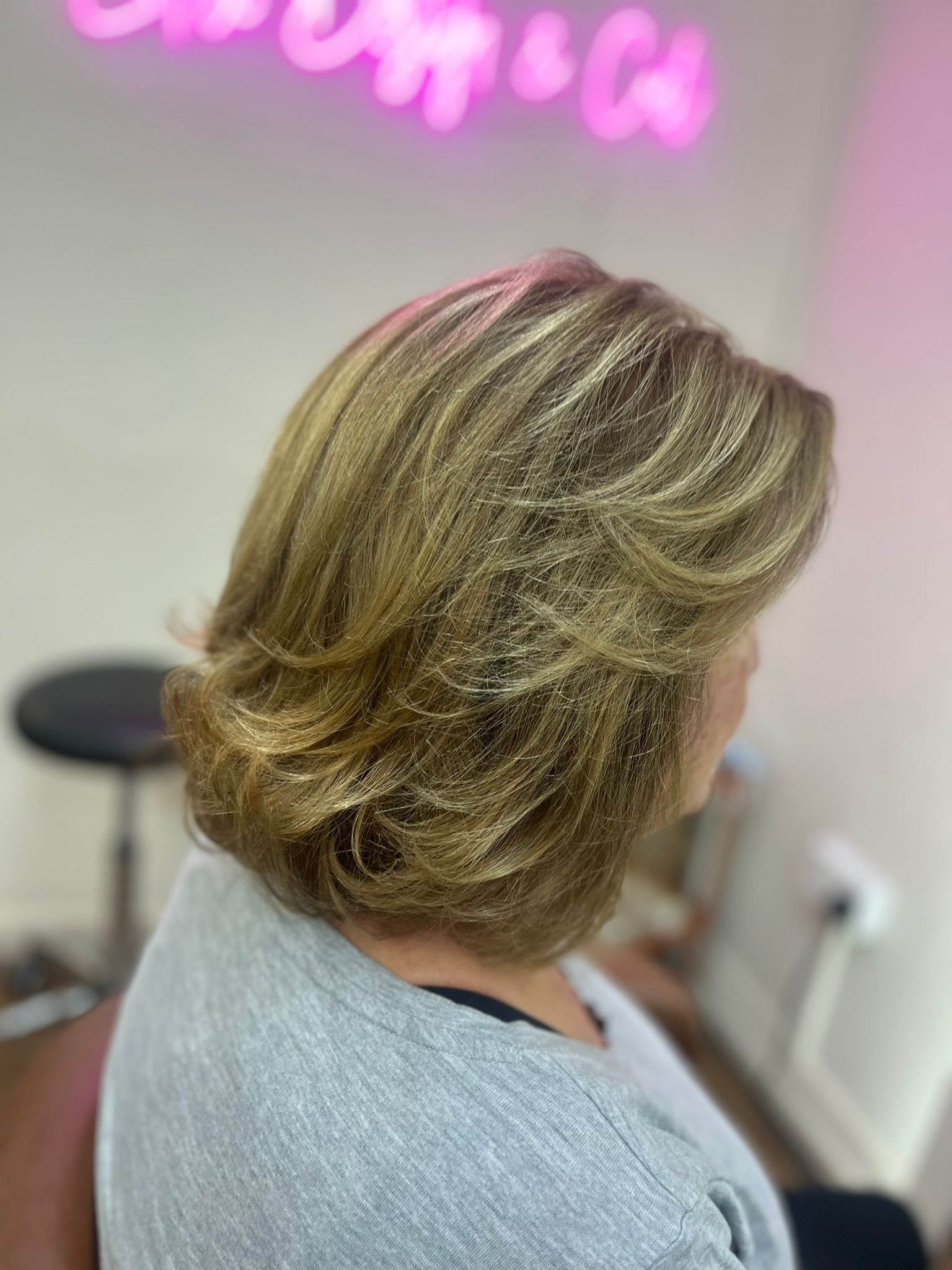 Root colour and flicky classic hairstyle